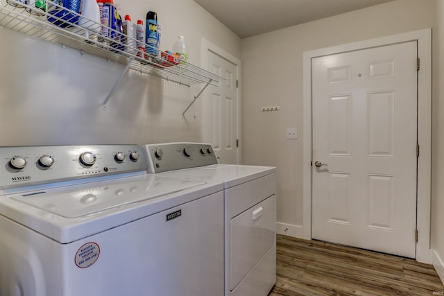 904-3 Reyling Dr, Jasper, IN 47546 - washroom with independent washer and dryer and wood finished floors