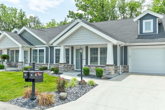 904-3 Reyling Dr, Jasper, IN 47546 - craftsman inspired home with a shingled roof, an attached garage, stone siding, a porch, and concrete driveway