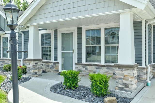 904-3 Reyling Dr, Jasper, IN 47546 - doorway to property with a porch and stone siding