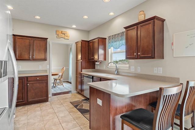 5590 Westfalen Way, Lafayette, IN 47905 - kitchen featuring stainless steel appliances, light countertops, a kitchen breakfast bar, a peninsula, and recessed lighting