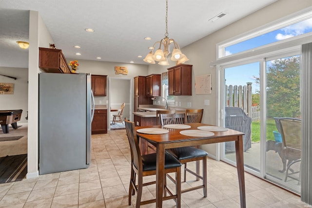 5590 Westfalen Way, Lafayette, IN 47905 - dining space with recessed lighting, light tile patterned floors, and a chandelier