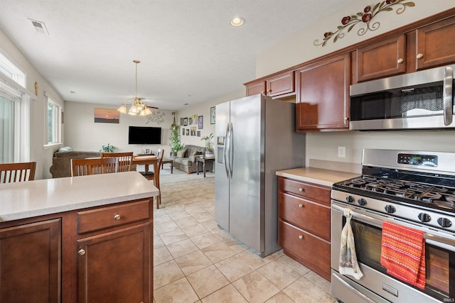 5590 Westfalen Way, Lafayette, IN 47905 - kitchen featuring stainless steel appliances, light countertops, open floor plan, light tile patterned floors, and recessed lighting