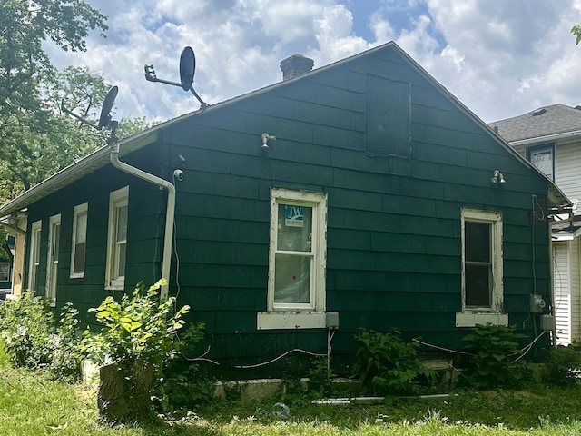 1034 Huey St, South Bend, IN 46628 - view of home's exterior with a chimney