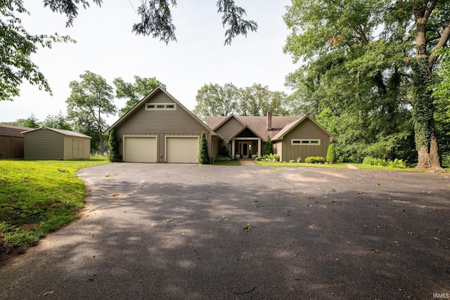 619 Cherrydale Dr, Monticello, IN 47960 - view of front of home with asphalt driveway and an attached garage