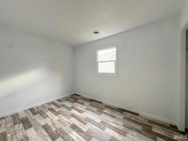 1032 E Dixon St, Kokomo, IN 46901 - spare room with wood finished floors and baseboards
