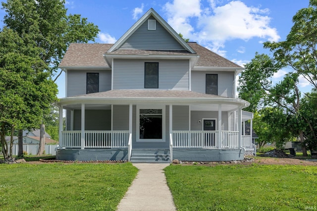 809 E 5th St, Fowler, IN 47944 - view of front of house featuring covered porch, roof with shingles, and a front lawn