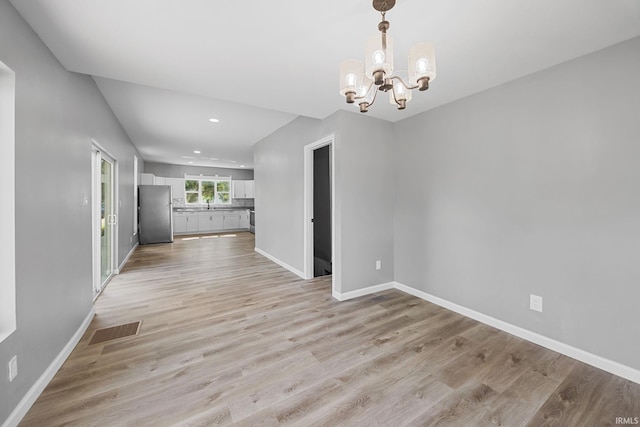 809 E 5th St, Fowler, IN 47944 - spare room featuring a chandelier, light wood-style flooring, and recessed lighting