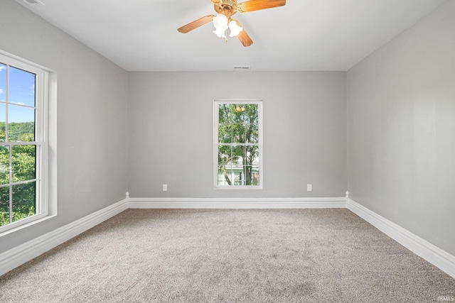809 E 5th St, Fowler, IN 47944 - carpeted empty room with healthy amount of natural light and a ceiling fan