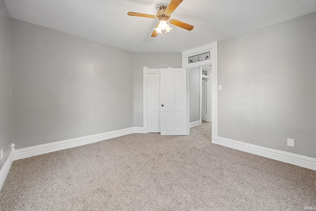 809 E 5th St, Fowler, IN 47944 - unfurnished bedroom with light colored carpet, a closet, and ceiling fan