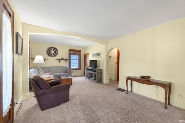 220 N Line St, Churubusco, IN 46723 - living area with arched walkways and carpet floors