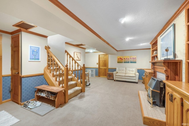 220 N Line St, Churubusco, IN 46723 - living area with light carpet, crown molding, stairs, a wainscoted wall, and a textured ceiling