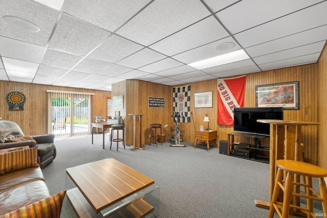 220 N Line St, Churubusco, IN 46723 - carpeted living area featuring wood walls and a paneled ceiling
