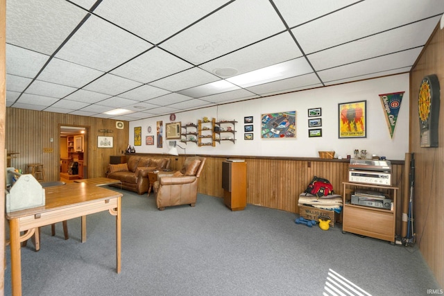 220 N Line St, Churubusco, IN 46723 - carpeted living room featuring a paneled ceiling and wooden walls