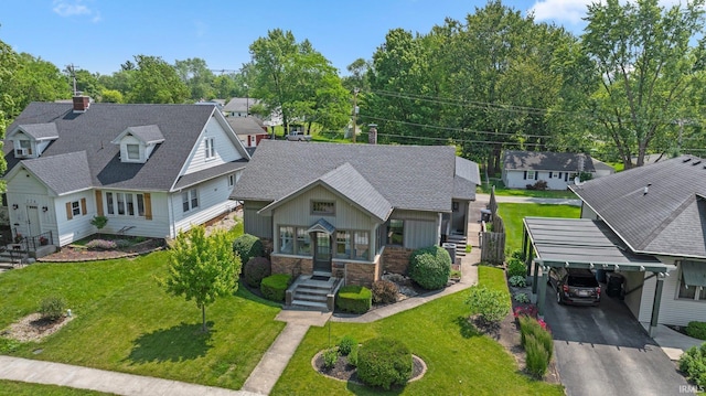 220 N Line St, Churubusco, IN 46723 - view of front of property with a residential view, a front yard, driveway, board and batten siding, and stairway
