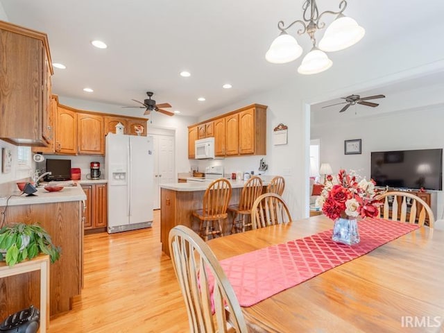 805 Alyssum Dr, Evansville, IN 47712 - dining space featuring ceiling fan, light wood-style floors, a chandelier, and recessed lighting