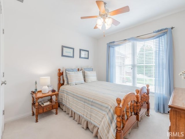 805 Alyssum Dr, Evansville, IN 47712 - bedroom with light carpet and ceiling fan