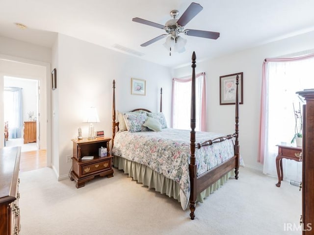 805 Alyssum Dr, Evansville, IN 47712 - bedroom featuring light colored carpet and a ceiling fan