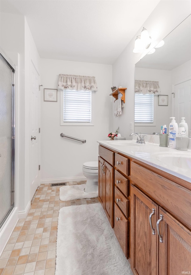 805 Alyssum Dr, Evansville, IN 47712 - full bath with double vanity, a shower with shower door, and tile patterned flooring
