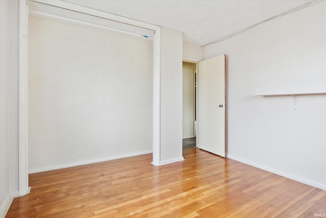 5210 W Washington St, South Bend, IN 46619 - unfurnished bedroom featuring light wood-type flooring and a closet