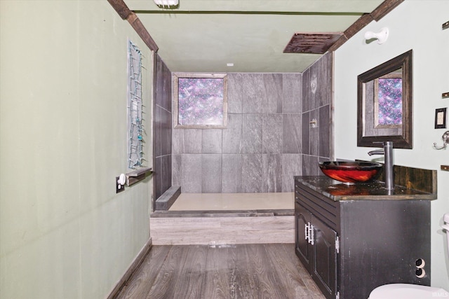 5210 W Washington St, South Bend, IN 46619 - full bathroom featuring tiled shower, vanity, and wood finished floors