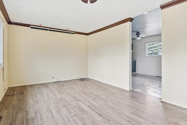 5210 W Washington St, South Bend, IN 46619 - spare room with a ceiling fan, wood finished floors, and ornamental molding