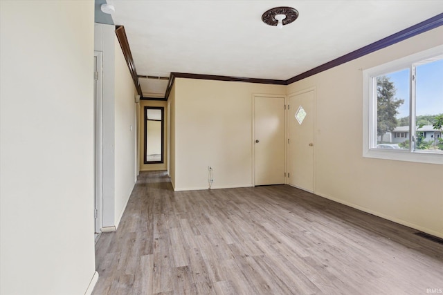 5210 W Washington St, South Bend, IN 46619 - spare room featuring ornamental molding, light wood-style flooring, and a smoke detector