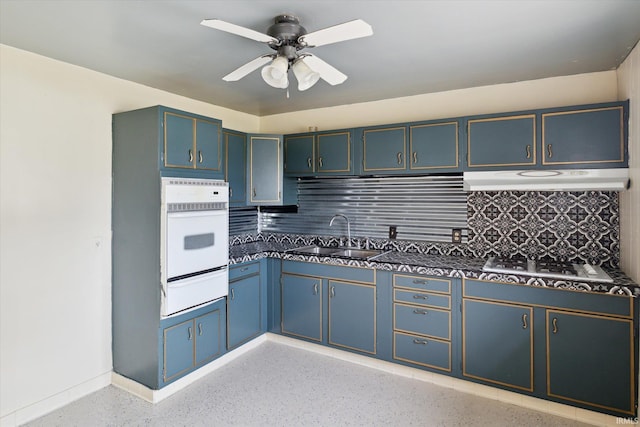 5210 W Washington St, South Bend, IN 46619 - kitchen featuring white oven, a warming drawer, under cabinet range hood, dark countertops, and gas stovetop