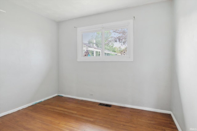 5210 W Washington St, South Bend, IN 46619 - empty room featuring baseboards and wood finished floors