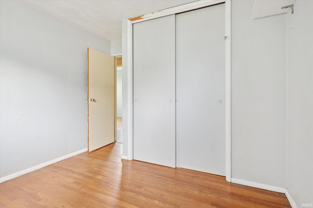 5210 W Washington St, South Bend, IN 46619 - unfurnished bedroom featuring light wood-type flooring and a closet