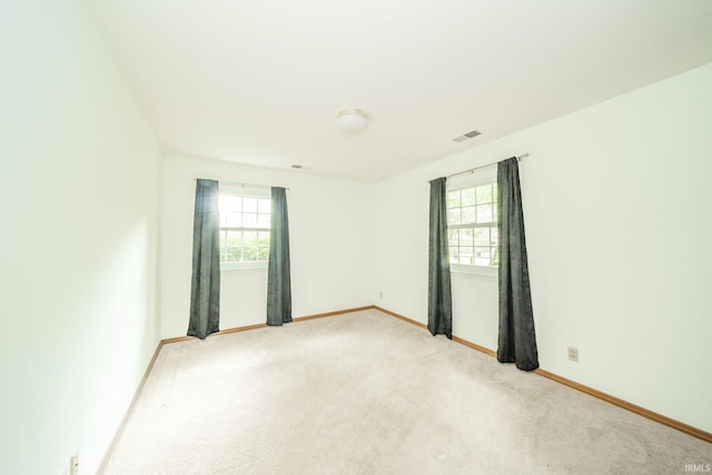 2613 Queensbury Rd, Muncie, IN 47304 - unfurnished room with plenty of natural light and light carpet