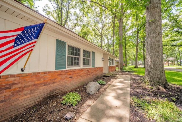 2613 Queensbury Rd, Muncie, IN 47304 - view of home's exterior with brick siding and board and batten siding