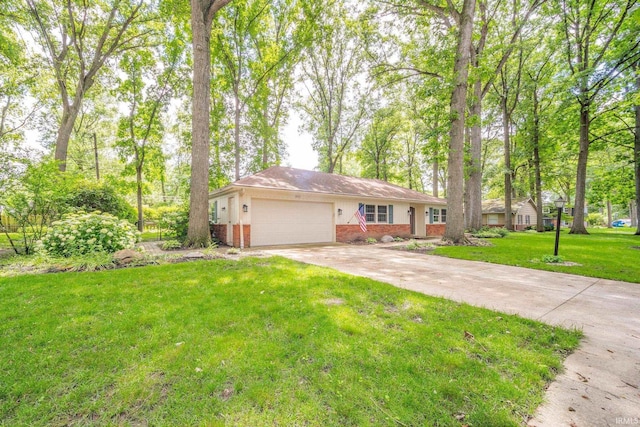 2613 Queensbury Rd, Muncie, IN 47304 - single story home featuring brick siding, concrete driveway, an attached garage, and a front yard