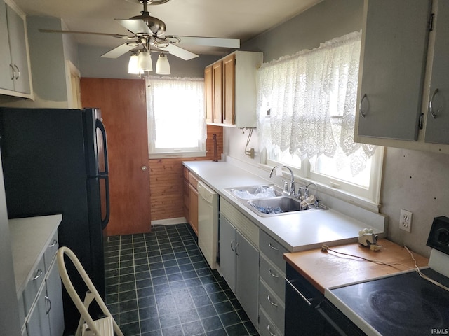 2407 George St, Logansport, IN 46947 - kitchen featuring white dishwasher, range with electric cooktop, freestanding refrigerator, ceiling fan, and light countertops