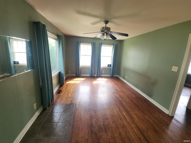 2407 George St, Logansport, IN 46947 - unfurnished room with a ceiling fan and dark wood-style flooring