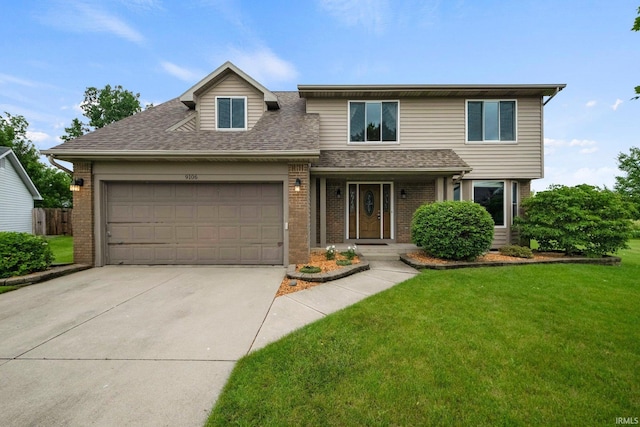 9106 Yellow Tree Ct, Fort Wayne, IN 46804 - view of front of property featuring brick siding, a garage, roof with shingles, and a front yard