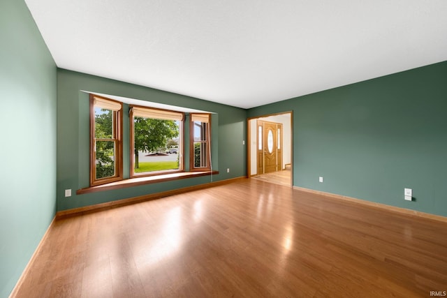 9106 Yellow Tree Ct, Fort Wayne, IN 46804 - spare room featuring wood finished floors and baseboards