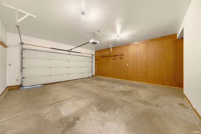 9106 Yellow Tree Ct, Fort Wayne, IN 46804 - garage featuring a garage door opener and baseboards