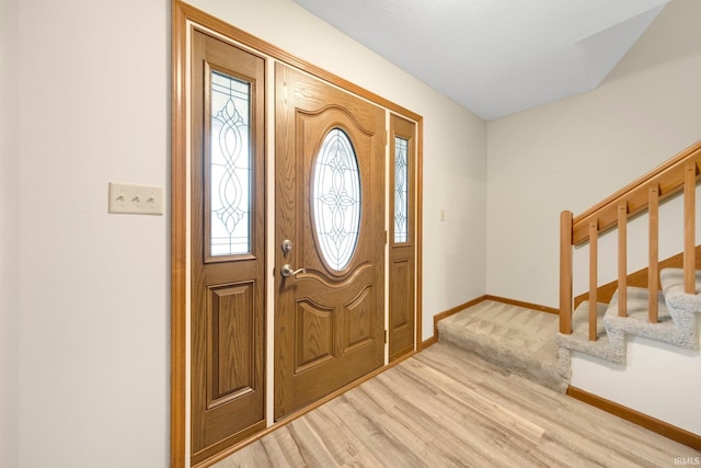 9106 Yellow Tree Ct, Fort Wayne, IN 46804 - foyer entrance featuring healthy amount of natural light, light wood finished floors, and stairs