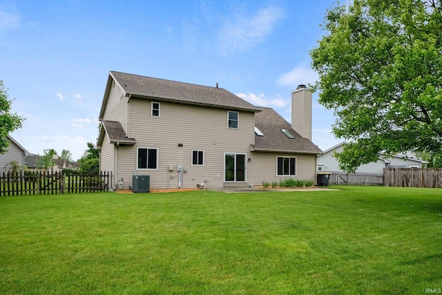 9106 Yellow Tree Ct, Fort Wayne, IN 46804 - back of property with a fenced backyard, a chimney, and roof with shingles