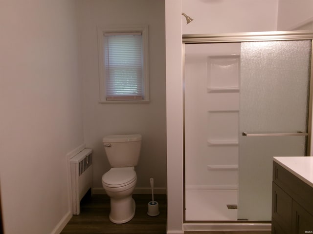908 N Hawthorne St, Marion, IN 46952 - full bathroom with radiator, a stall shower, vanity, and wood finished floors