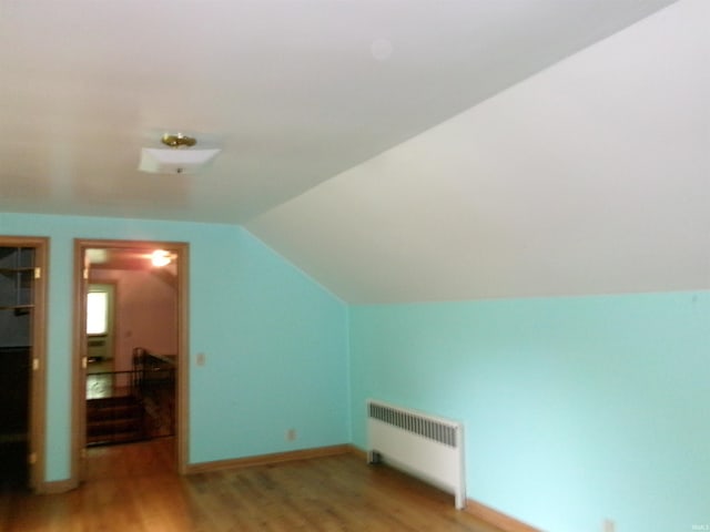 908 N Hawthorne St, Marion, IN 46952 - bonus room with radiator heating unit, light wood-type flooring, and vaulted ceiling