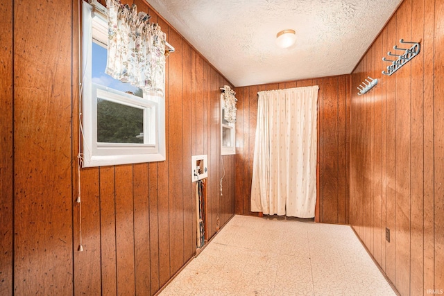 610 S Washington St, Warsaw, IN 46580 - entryway with wooden walls, tile patterned floors, and a textured ceiling
