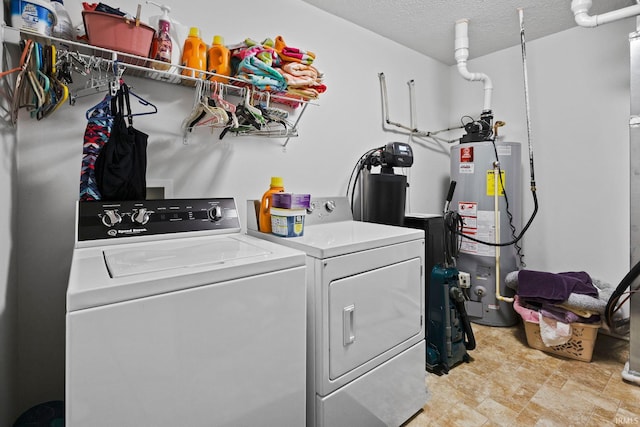 807 Percheron Pl, Lafayette, IN 47905 - laundry room with water heater, washing machine and dryer, and a textured ceiling