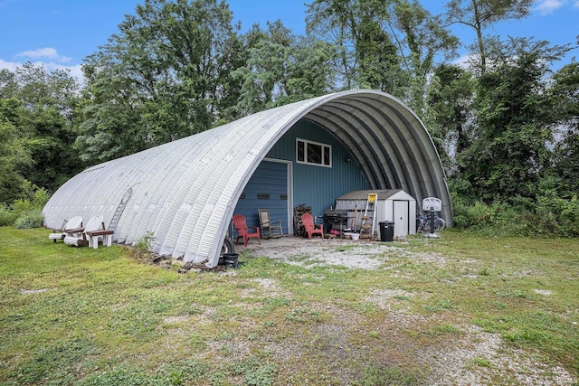 58380 Ash Rd, Osceola, IN 46561 - view of pole building featuring a lawn, view of wooded area, and a storage unit