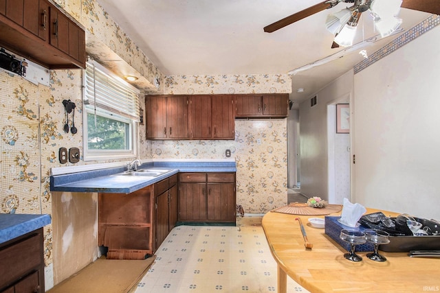 1356 Hampshire Dr, South Bend, IN 46614 - kitchen with ceiling fan, light floors, and wallpapered walls