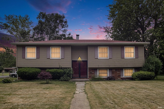 1356 Hampshire Dr, South Bend, IN 46614 - split foyer home with a chimney and a lawn