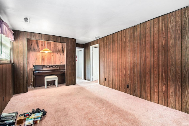 1356 Hampshire Dr, South Bend, IN 46614 - unfurnished living room featuring carpet floors and wooden walls