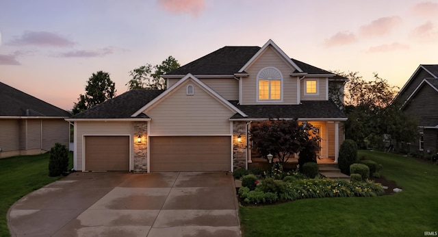 11322 Miramar Cv, Roanoke, IN 46783 - traditional-style house featuring a yard, driveway, a garage, and a shingled roof