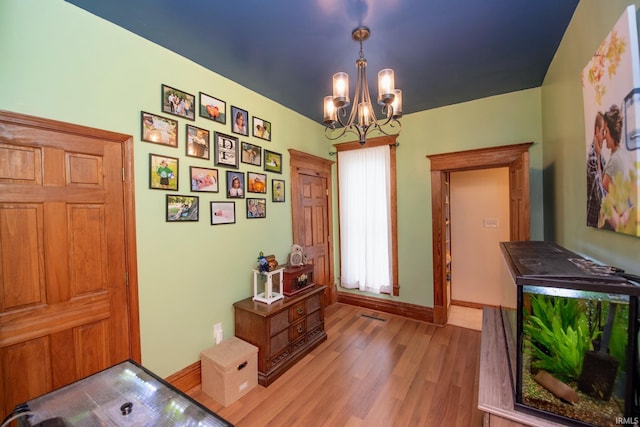 403 E Columbia St, Flora, IN 46929 - foyer featuring light wood finished floors and a chandelier