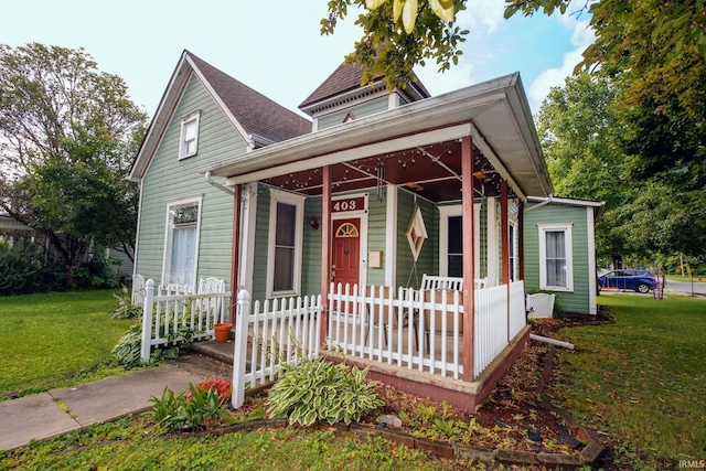 403 E Columbia St, Flora, IN 46929 - view of front of property with a porch and a front yard